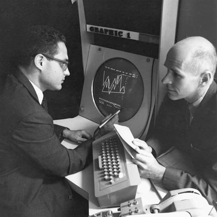 贝尔实验室的劳伦斯·卢斯勒（Lawrence Losler）与马克思·马修斯在Graphics 1系统前，1967年